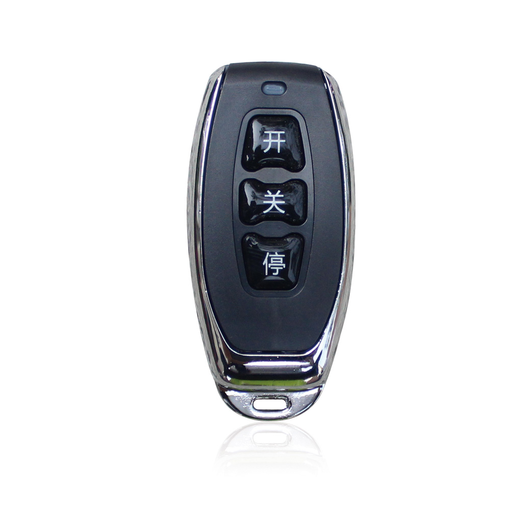 Supplied black and chrome hand-held control with three visible vertical buttons, reference R2