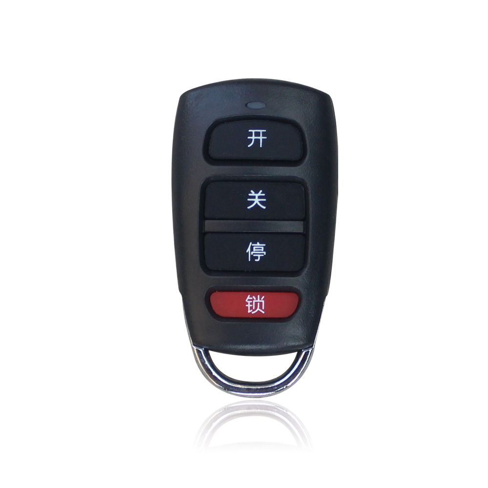 Supplied black hand-held control with four visible buttons and silver ring, reference R1